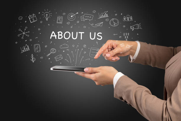 About close up of a touchscreen with about us inscription, social media concept